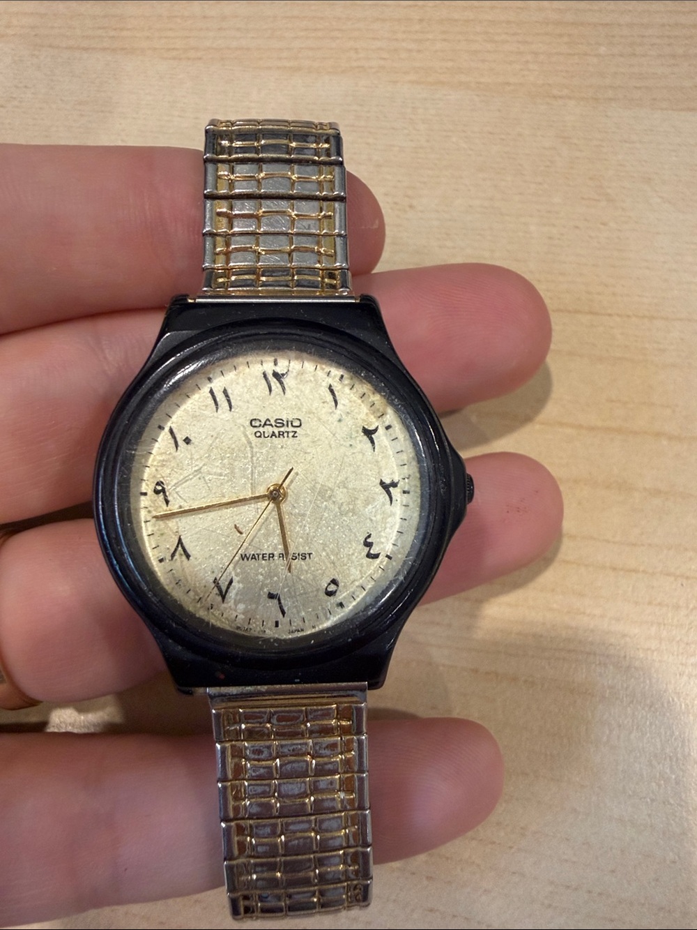 Casio MQ-82 with gold band and Arabic numbers